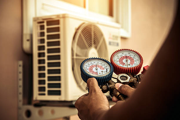 Professional Air Conditioning Service technician working in Fairmount, GA